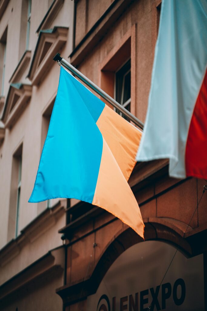Vertical shot of Ukrainian flag on a flagpole in Bydgoszcz, Poland.